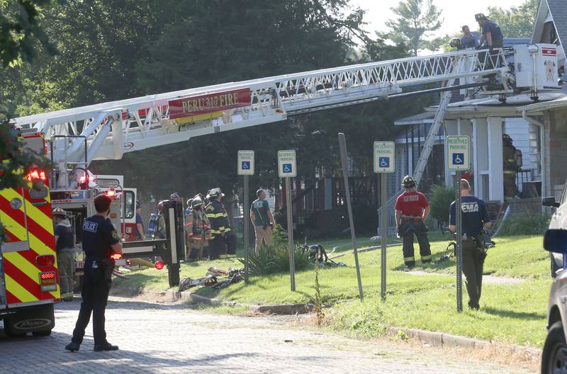 Firefighters work the scene of a structure fire in the 300 block of West Erie Street on Thursday, Aug. 28, 2025 in Spring Valley. The fire happened shortly after 4:45p.m. A Mutual Aid Box Alarm System was set out when firefighters arrived. Fire departments from Princeton, Spring Valley, Peru, Ladd, Cherry, Standard and La Salle were on the scene. Peru and Spring Valley EMS were also dispatched. Spring Valley Police assisted on the call as well.