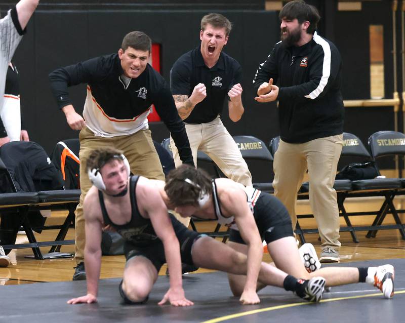Kaneland coaches celebrate as Alex Gochis wins his match in overtime against Sycamore’s Jayden Dohogne during their 138 pound match Thursday, Jan. 9, 2025, at Sycamore High School.