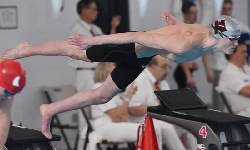 Naperville Central’s Max Goettsch leaves the starting block in the 100-yard freestyle during the boys state swimming and diving finals at FMC Natatorium on Saturday, Feb. 24, 2024 in Westmont.