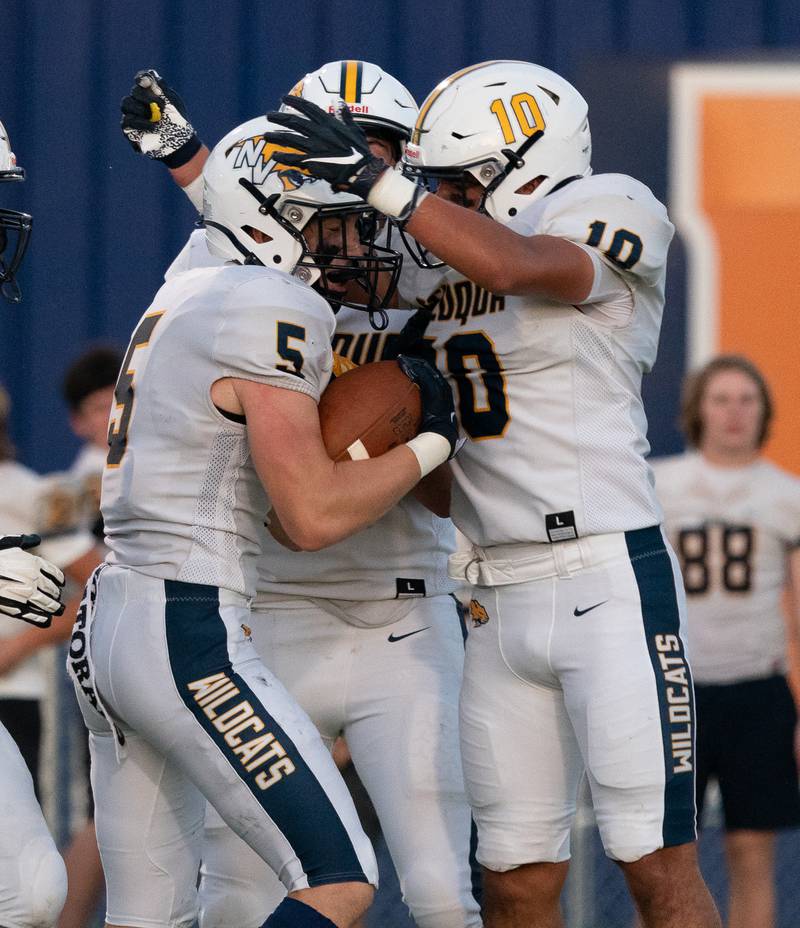 Neuqua Valley's Grant Larkin (5) celebrates with his team after scoring a touchdown against Oswego during a football game at Oswego High School on Friday, Aug 26, 2022.