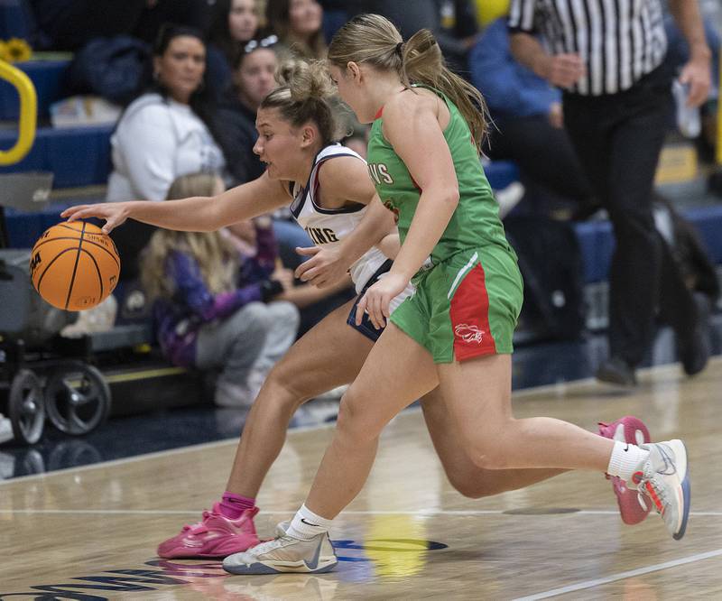 Sterling’s Jae James reaches for a ball against LaSalle-Peru’s Emma Jerb Tuesday, Dec. 3, 2024, at Sterling High School.
