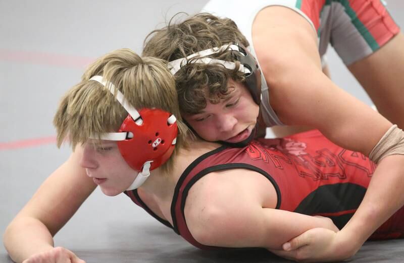 Streator's Jaxon Wachowski wrestles L-P's Rylnd Rynkewicz during a meet on Wednesday, Dec. 13, 2023 in Sellett Gymnasium at L-P High School.