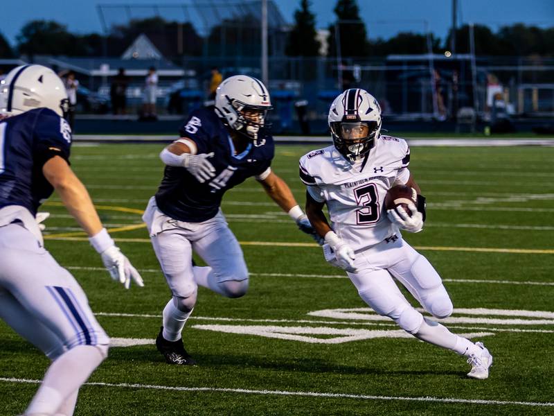 Plainfield North's Darin Ashiru runs downfield against Plainfield South on Sept. 13, 2024.