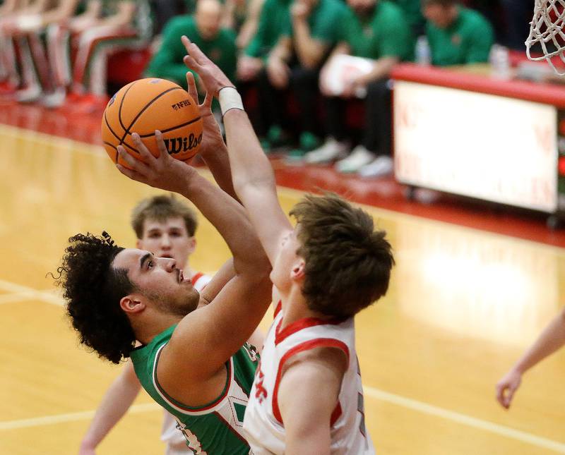 L-P's Marion Persich has his shot blocked by Morton's Owen Adams during the Class 3A Sectional semifinal game on Tuesday, March 3, 2026 in Kingman Gymnasium at Ottawa High School.