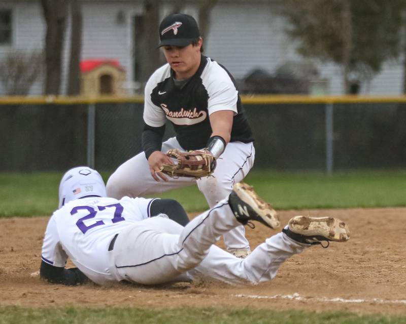 Plano's Brandon Ramos (27) dives back to third base during baseball game between Sandwich at Plano on Thursday, April 9, 2025 in Plano.