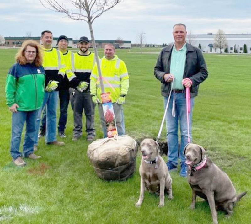 Oswego Village President Troy Parlier (and his two pups), Public Works Director Jennifer Hughes, along with Village Forester Russ Garcia and his crew planted a maple tree at the future Oswego Dog Park located next to the Public Works facility. (Photo provided)