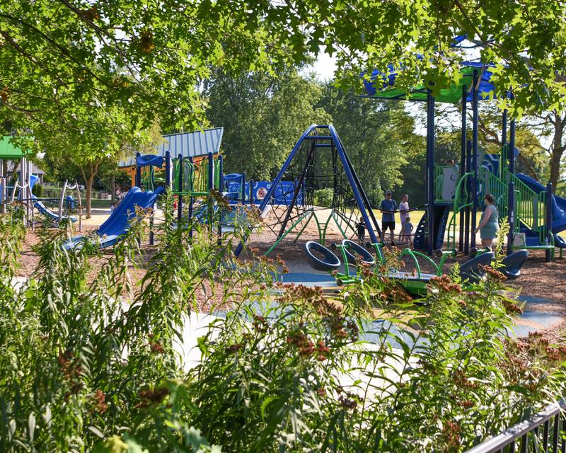Two walking bridges can be utilized through some tall grass that leads you to the redesigned Prairie Park that had a dedication on Saturday Aug. 16, 2025, in Elburn.