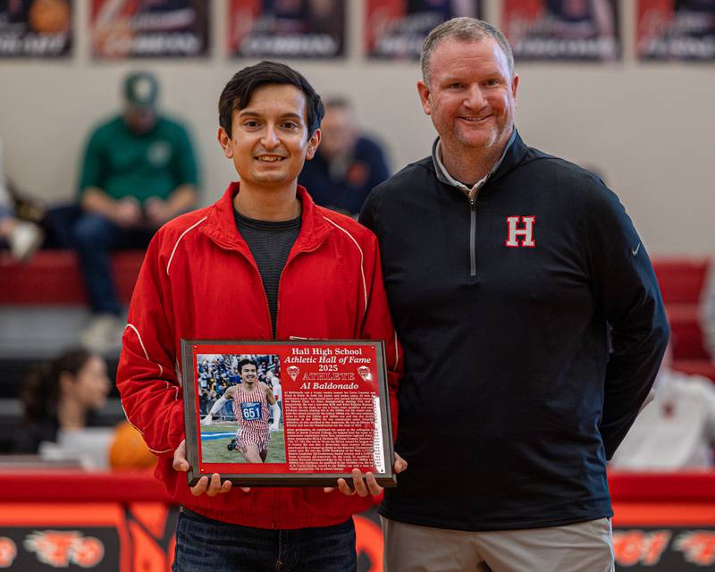 Al Baldonado and Tom Keegan pose for photo as he's inducted into the 2026 Hall High School Hall of Fame on Saturday, January 31, 2026 at Hall High School in Spring Valley.