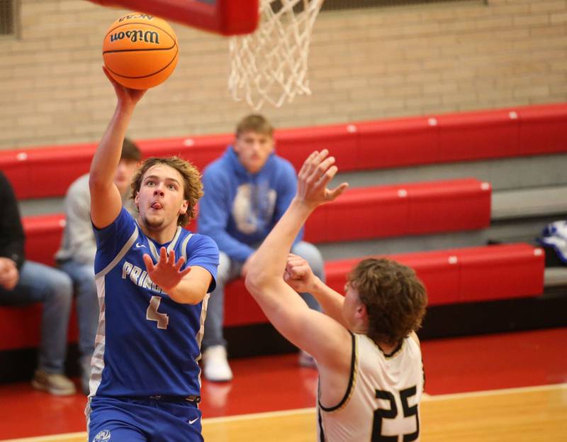 Princeton's Jayden Fulkerson eyes the hoop as Oak Forest's Hayden Noha defends during the Dean Riley Shootin' The Rock Thanksgiving Tournament on Tuesday, Nov. 26, 2024 in Kingman Gym at Ottawa High School.
