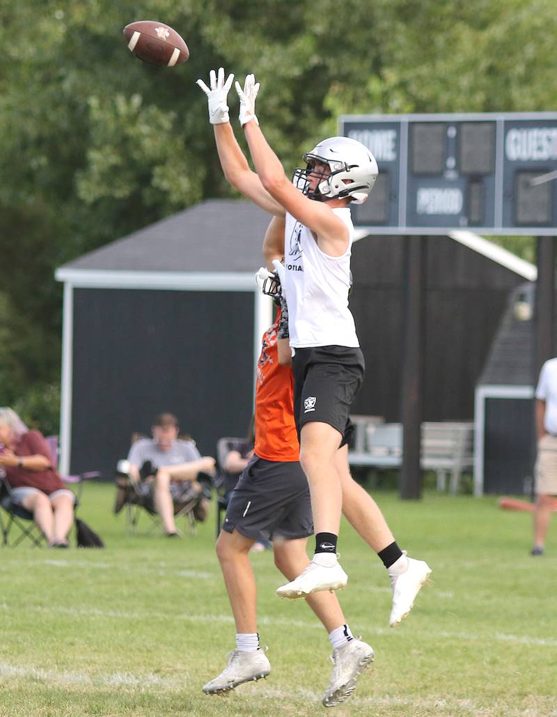 Kaneland and DeKalb players compete during 7-on-7 drills Tuesday, July 26, 2022, at Kaneland High School in Maple Park.