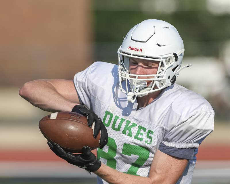 Hunter Stepanich makes a reception at York High School football practice, Thursday, Aug 14, 2025  in Elmhurst.