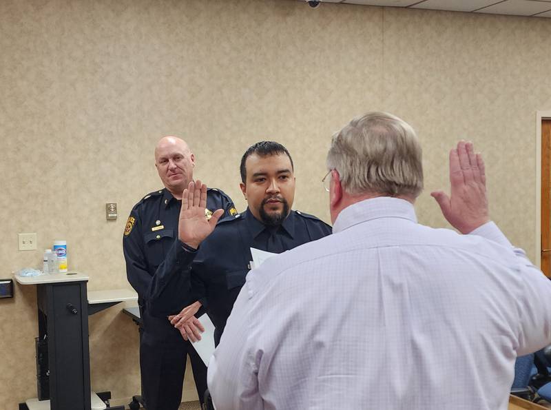 Officer Alex Jaramillo was sworn in by City Clerk Peter Nelson in front of those in attendance including his wife Lorena and daughters Aaliyah and Olivia.