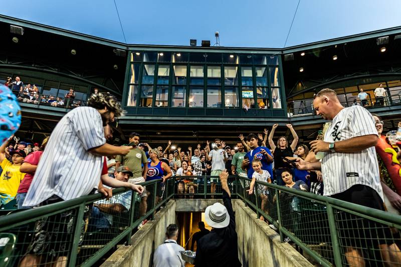 Slammers co-owner Bill Murray joins Slammers staff members to help distribute hot dogs to fans following the Wiener Drop World Record Attempt, sponsored by Pabst Light, at Duly Heath and Care Field on July 22, 2025.