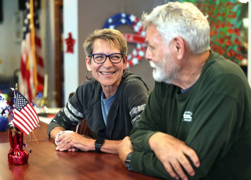 Mike and Karen Giuliano, both U.S. Air Force veterans from DeKalb, share a laugh as they talk Thursday Sept. 28. 2023, at the American Legion Post 66 in DeKalb, about their time in the Air Force, where they met, and how they combined serving their country with raising a family.