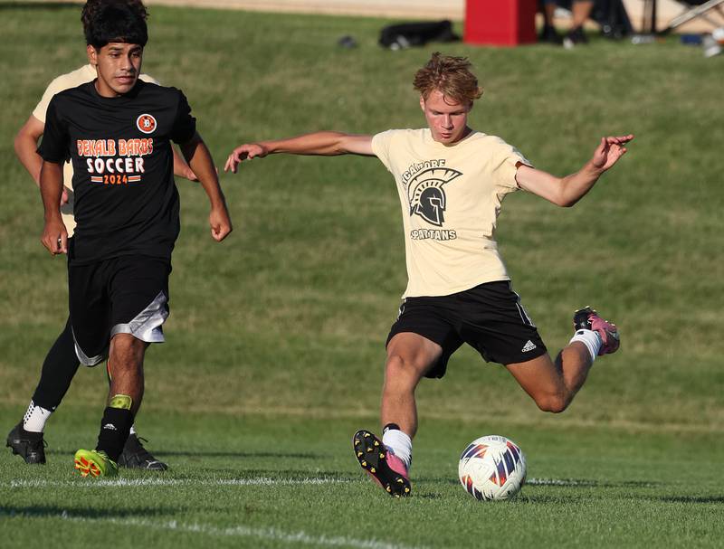 Sycamore’s Aiden Sears takes a shot in front of a DeKalb player Wednesday, July 17, 2024, during their scrimmage at Sycamore High School.