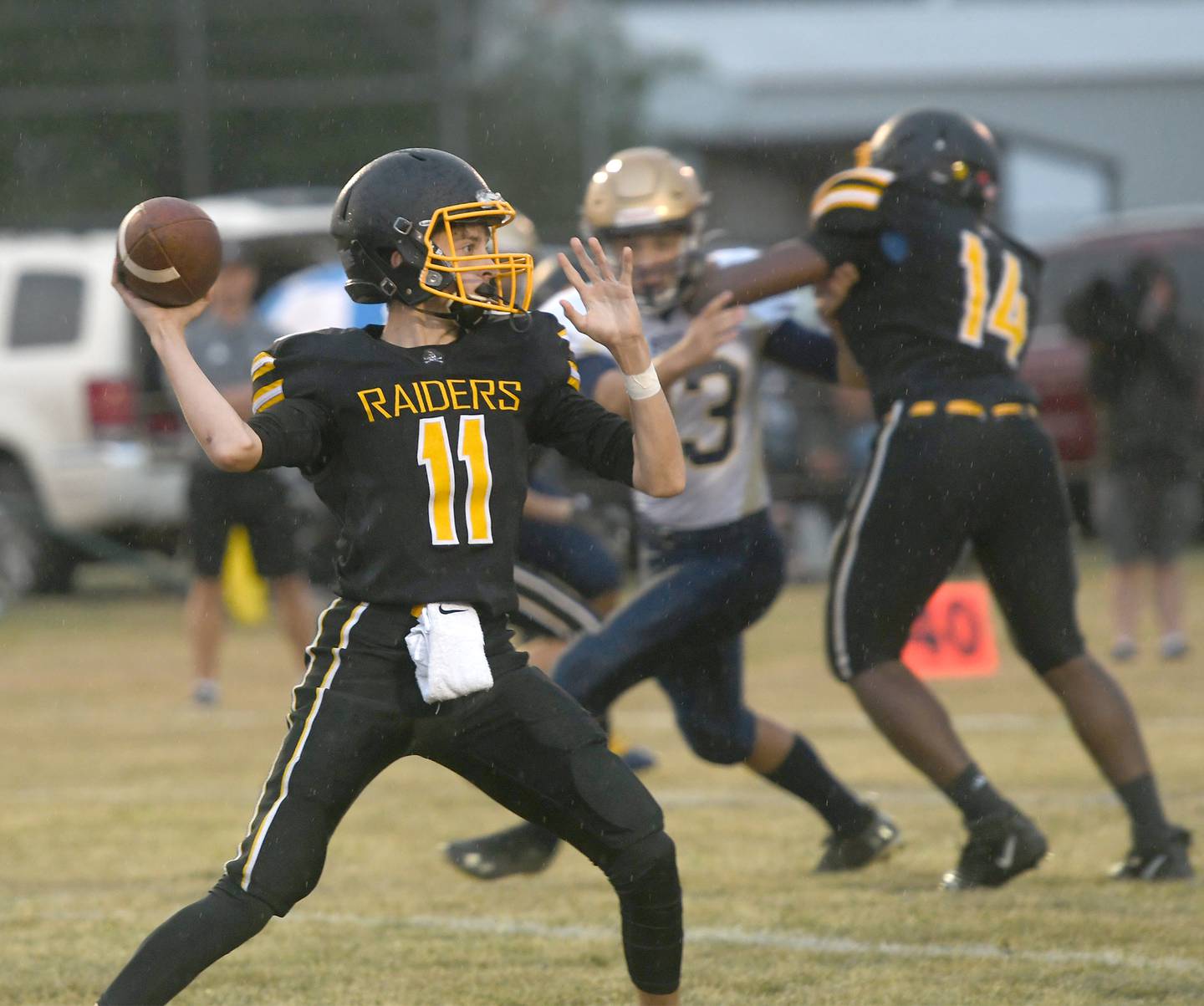 AFC quarterback Carson Rueff looks to pass against Polo.