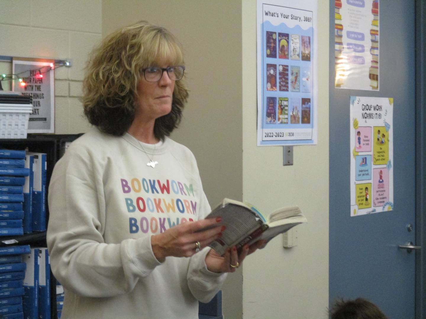 Bednarcik Junior High School sixth-grade language arts teacher Heather Kraus reads to her students.