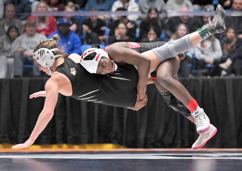 Huntley’s Janiah Slaughter throws Oak Forest’s Alexandra Sebek in the 100-pound class at the girls wrestling state finals tournament at Grossinger Arena in Bloomington on Saturday, Feb. 28, 2026.