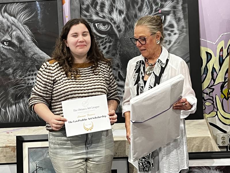 Corinne Francis receives a scholarship from the Ottawa Art League, in memory of Lyn Prafcke, from Lyn's daughter Nancy Prafcke.