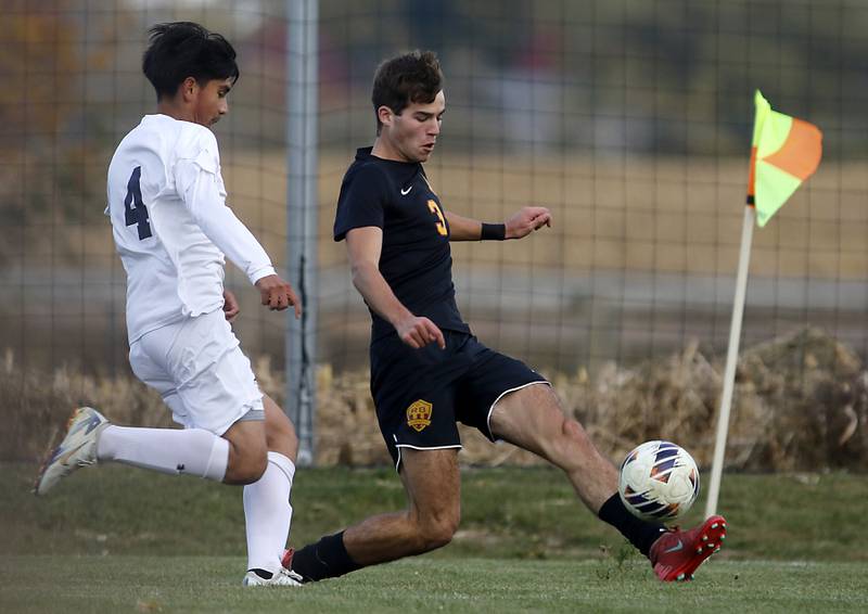 Richmond-Burton's Dane Gardner (right) tries to get position to takes a shot on goal as F.W. Parker's Jayden Flores defends during an IHSA Class 1A Johnsburg Sectional semifinal match on Oct. 28, 2025, at Johnsburg High School.