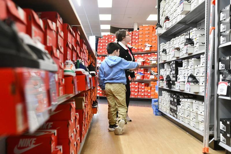 A Steuben Elementary student chooses a new pair of shoes at Shoe Carnival with help from Kankakee School District paraprofessional Julissa Avalos as part of the Kankakee Kiwanis Club's annual “All God’s Children Must Have Shoes” event on Feb. 27, 2025.