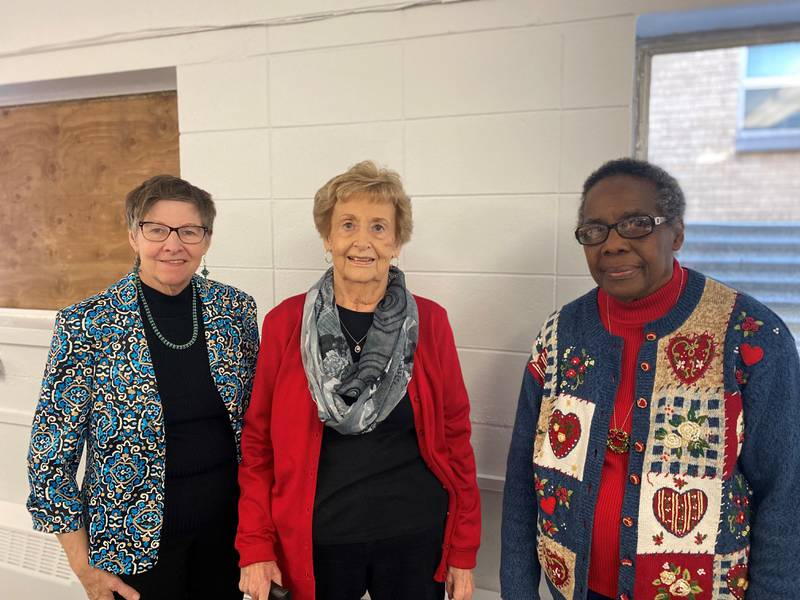 Telephone Reassurance Program volunteers pose for a photo at the volunteer Christmas Party in Kankakee on December 2, 2022. Pictured, from left, are Marie McCurdy, Rita Nowack and Sonia Humes. Catholic Charities, Diocese of Joliet, is expanding its Telephone Reassurance Program to Will and Grundy counties and is currently seeking volunteers and clients.