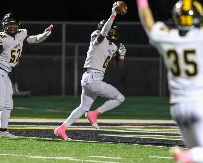 Joliet West's Micah Mcnair (8) celebrates a pick six during football game between Joliet West at Plainfield Central.   Oct 20, 2023.