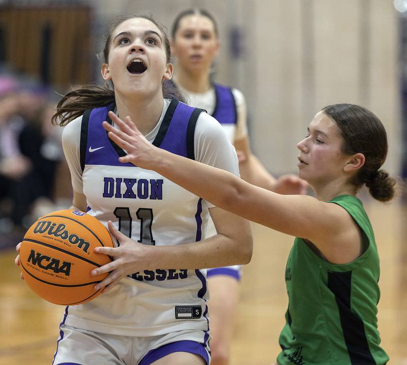 Dixon's Kiley Gaither looks to the hoop against Rock Falls’ Elizabeth Lombardo Friday, Jan. 31, 2025, at Dixon High School.