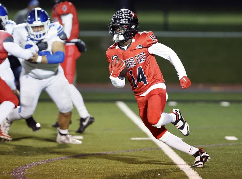 Glenbard East's Malachi Miller (14) runs the ball during the varsity football game between Riverside Brookfield and Glenbard East on Friday, Oct. 24, 2025 in Lombard, IL.