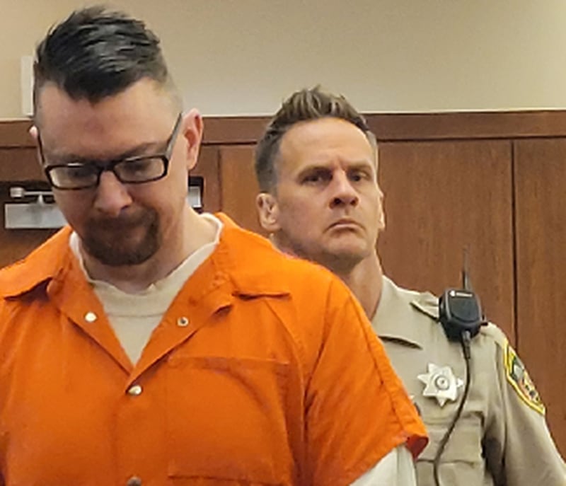 An Ogle County sheriff's deputy escorts first-degree murder defendant Duane Meyer into court on Wednesday, Sept. 14, 2022.