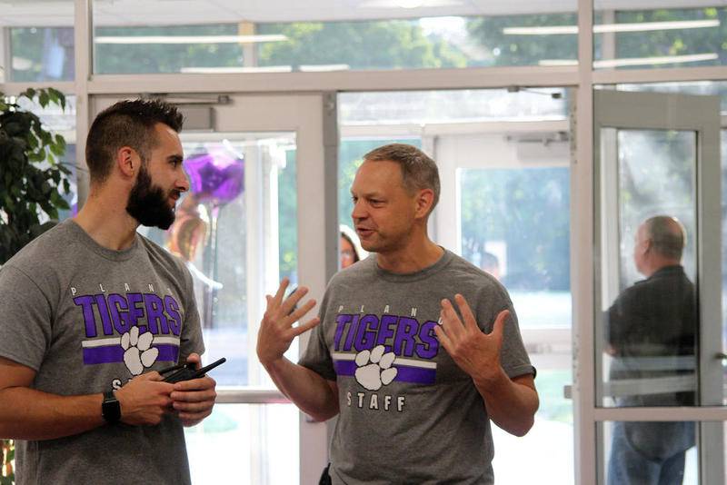 Plano Middle School Principal Mark Heller (right) chatted with faculty members and welcomed students back for the first day of the 2019-2020 school year, Wednesday, Aug. 14.