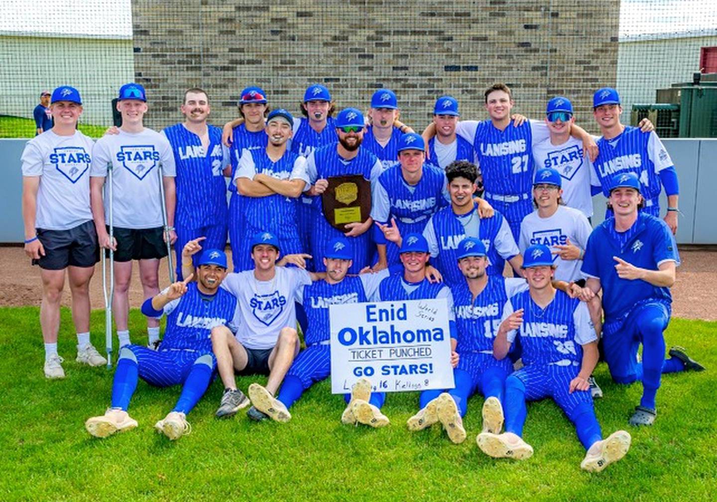 Former St. Bede multi-sport athlete Jarret Olson (holding trophy) is the pitching coach at Lansing Community College where he's helped the Stars to back-to-back NJCAA Division II World Series appearances.