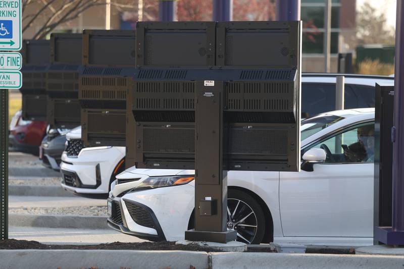 Customers place their orders at the drive-thru at CosMc’s, McDonald’s first small format beverage driven concept drive-thru, on Friday, Dec. 8, 2023, in Bolingbrook.