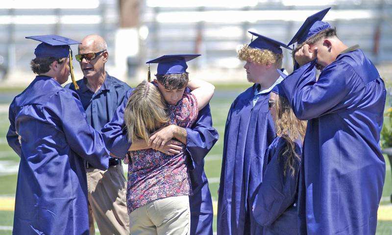 SHS students console the parents of Kaden Beer, a member of the class of 2005 killed in an accident. Kaden recieved an honorary diploma. The Sterling Class of 2025 Commencement Ceremony was held on Sunday, May 18, 2025 at Roscoe Eades Field in Sterling.