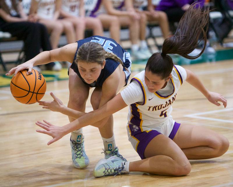 Nazareth's Stella Sakakas recovers the lose ball from Drowners Grove North's Campbell during the Dave Yates Chicagoland Showcase on Saturday, Dec7,2024 at Fremd in Palatine.