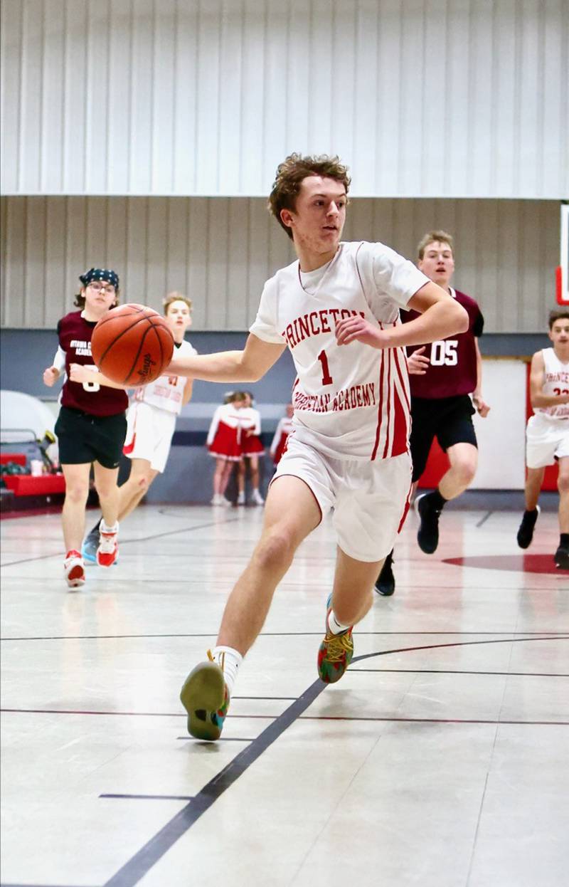 Princeton Christian Academy's Julian Mucha drives in Tuesday's game vs. Ottawa Christian Academy at Howard Hoffman Memorial Gym. The Eagles won 57-42.
