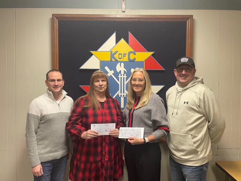 Calvert Council Knights of Columbus in La Salle donated $4,338 each to Lighted Way and Horizon House using proceeds from the annual Tootsie Roll drive. At the Jan. 7, 2025, check passing are fundraiser chairman Kyle Foley, Alice Buczkowski, administrative assistant for Horizon House, Mary Mauck, assistant administrator for Lighted Way, and Grand Knight Jacob Green.
