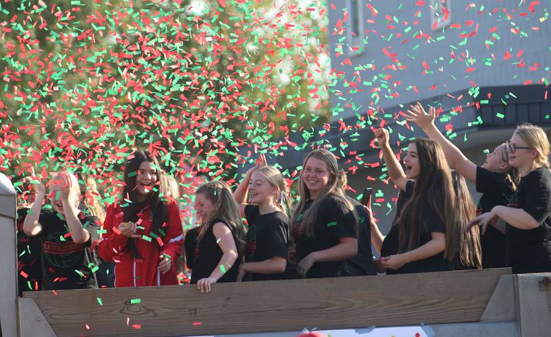 The L-P volleyball team passes through confetti during the L-P homecoming parade on Thursday, Oct. 2, 2025 downtown La Salle.