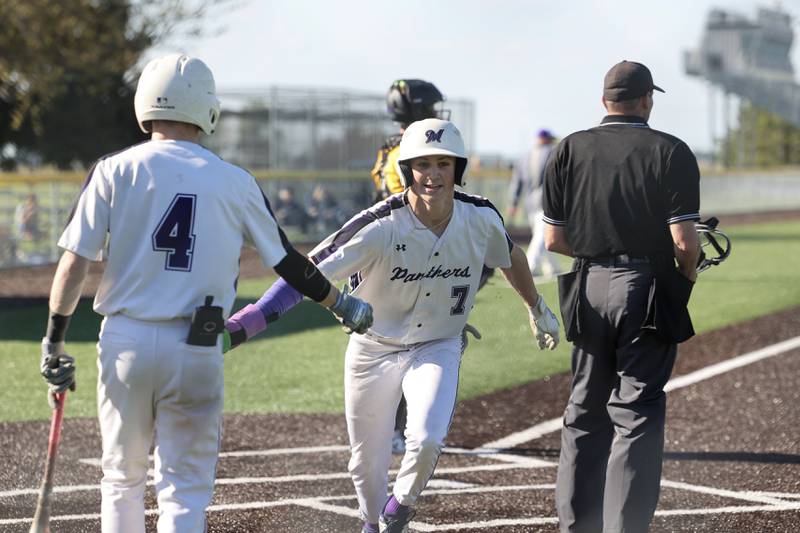 Manteno’s Quinn Borden high fives teammate Tyler Buehler after scoring a run during the Panthers’ 8-7 victory over Herscher on Tuesday, May 6, 2025.