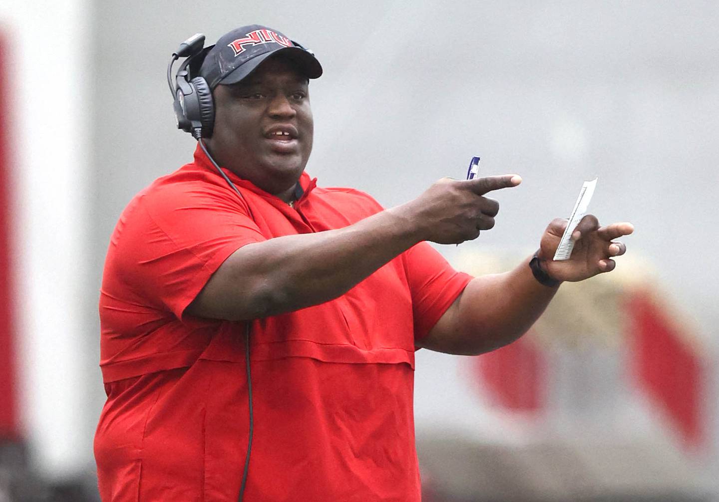 Northern Illinois University football head coach Thomas Hammock gives instruction during spring practice Wednesday, April 6, 2022, in the Chessick Practice Center at NIU in DeKalb.