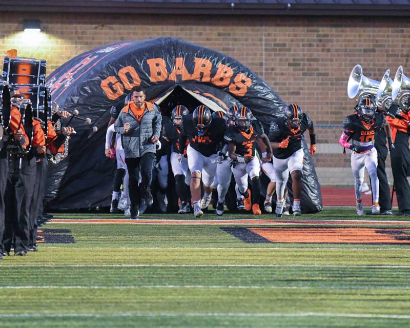 DeKalb High School football team takes the field on Friday Oct. 4, 2024, for warmups as they take on Andrews High School during homecoming at DeKalb High School.