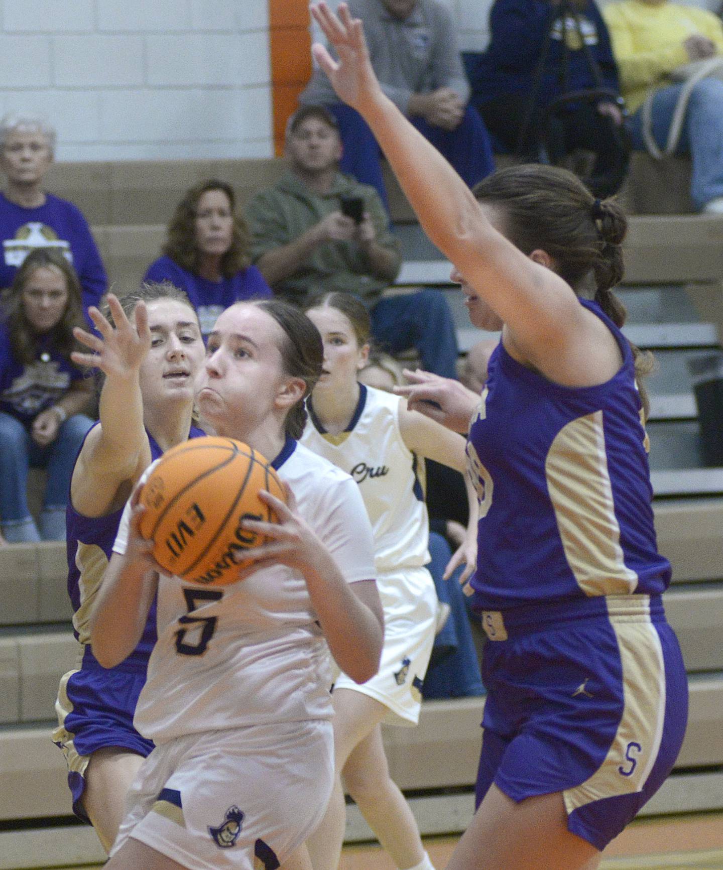Marquette’s Chloe Larson gets between the Serena defense as she eyes the basket during the second quarter of Saturday's championship of the Falcon-Irish Thanksgiving Tournament at Flanagan-Cornell High School.