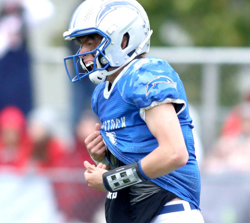 Woodstock’s Caden Thompson celebrates a touchdown against Ottawa in varsity football at Larry Dale Field on the campus of Woodstock High School Saturday.