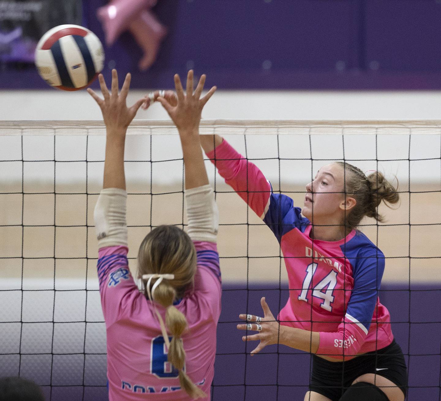 Dixon’s Leah Carlson hammers a shot against Newman’s Brooklyn Smith Thursday, Oct. 2, 2025.
