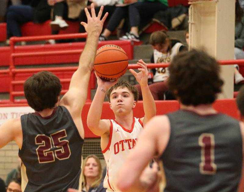 Ottawa's Huston Hart shoots a jump shot over Morris's Blane Beshoar on Wednesday, Jan. 3, 2024 at Kingman Gym.