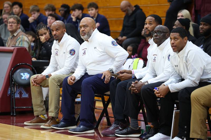 Kankakee head coach Chris Pickett, second from left, watches a free throw alongside his assistant coaches during the Kays' 74-60 victory over Mahomet-Seymour on Tuesday, Dec. 2, 2025.