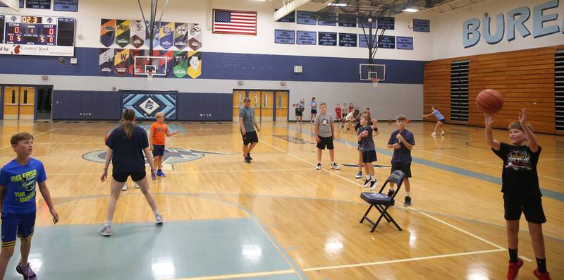 Kids work on shooting skills during the Fellowship of Christian Athletes Basketball Camp on Tuesday, July 8, 2025 at Bureau Valley High School.