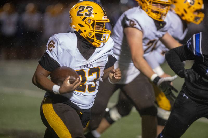 Carmel's Jorden Moore  carries the ball for a gain against St. Charles North at the Class 7A Second Round playoff game on Saturday, Nov.8,2025 in St. Charles.