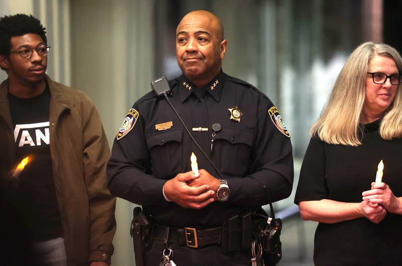 DeKalb Police Chief David Byrd holds a candle Monday, Oct. 3, 2022, at the Egyptian Theatre during the Safe Passage domestic violence vigil.