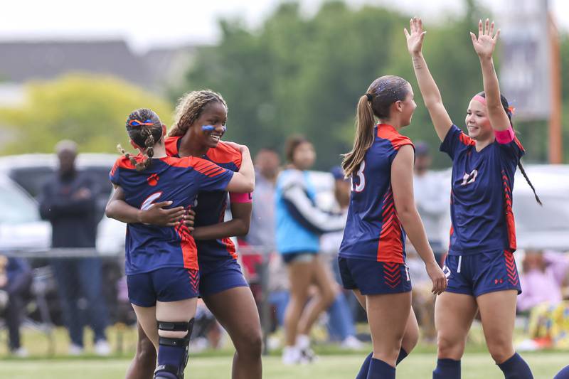 Oswego's Jordyn Washington (18) celebrates her second goal with teammates during Class 3A regional final soccer match between Neuqua Valley at Oswego on Saturday, May 23, 2026 in Oswego.